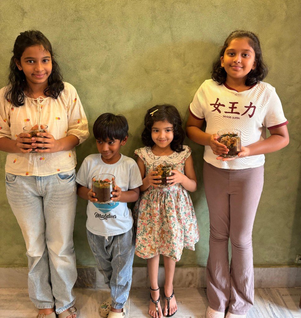 Children holding their terrarium creations